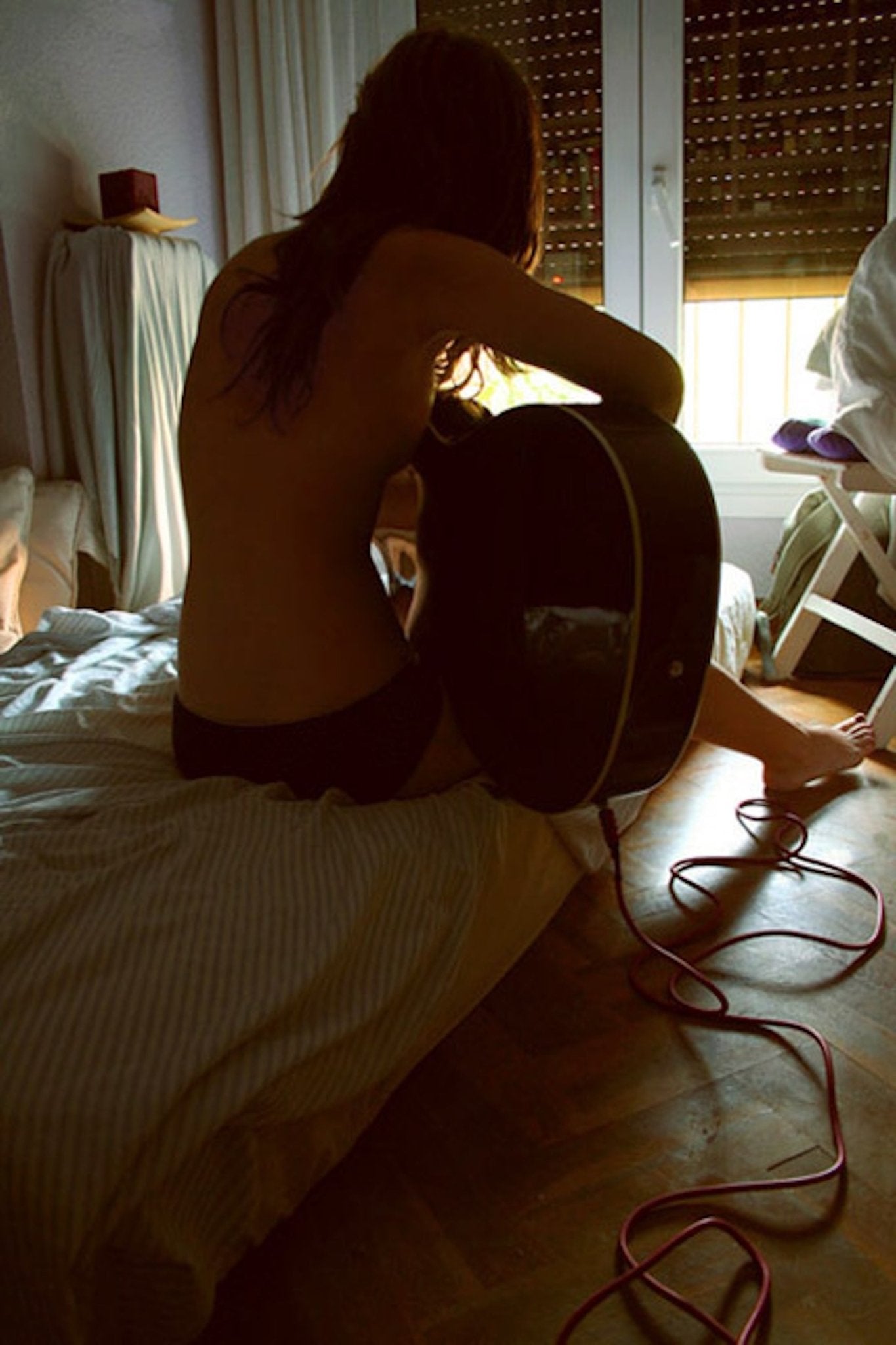She Wasn’t Playing the Guitar. She Was Holding It Hostage - Château Wanton
